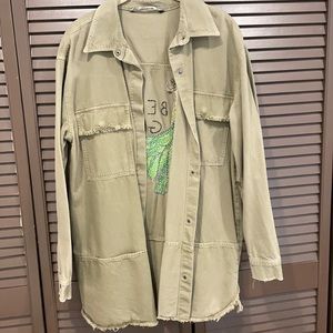 Green long denim jacket with detailing on the back